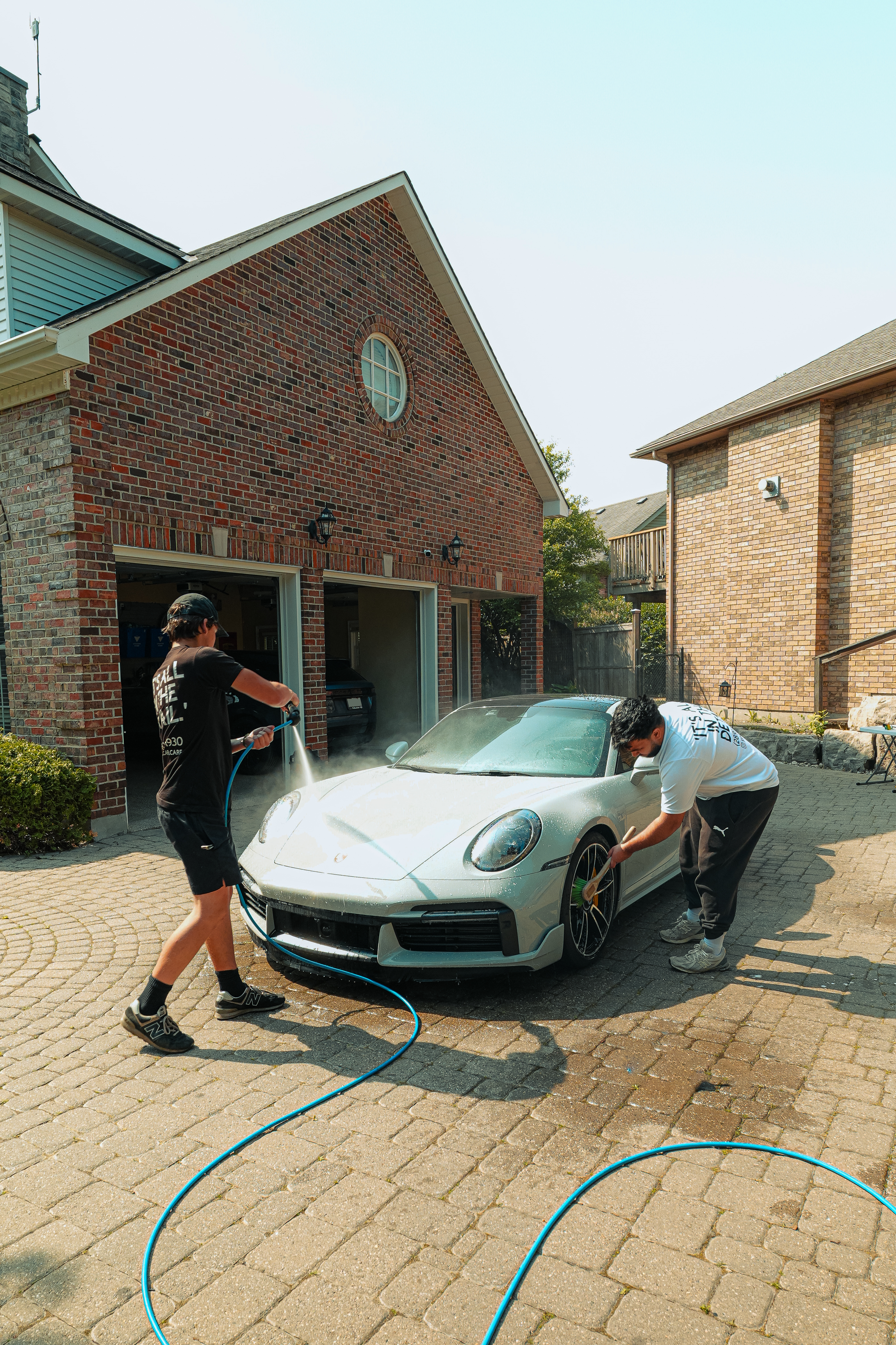 Team detailing a Porsche